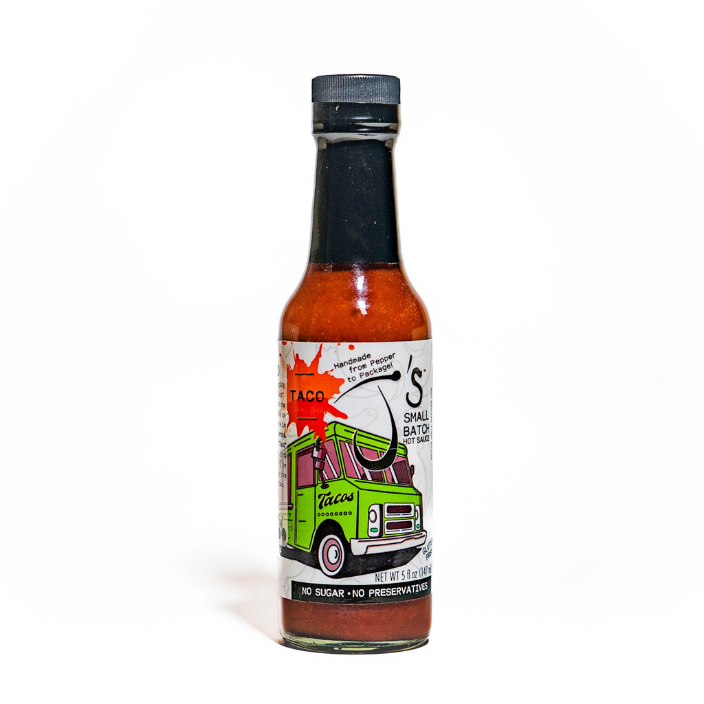 Hot sauce bottle with colorful label on a white background