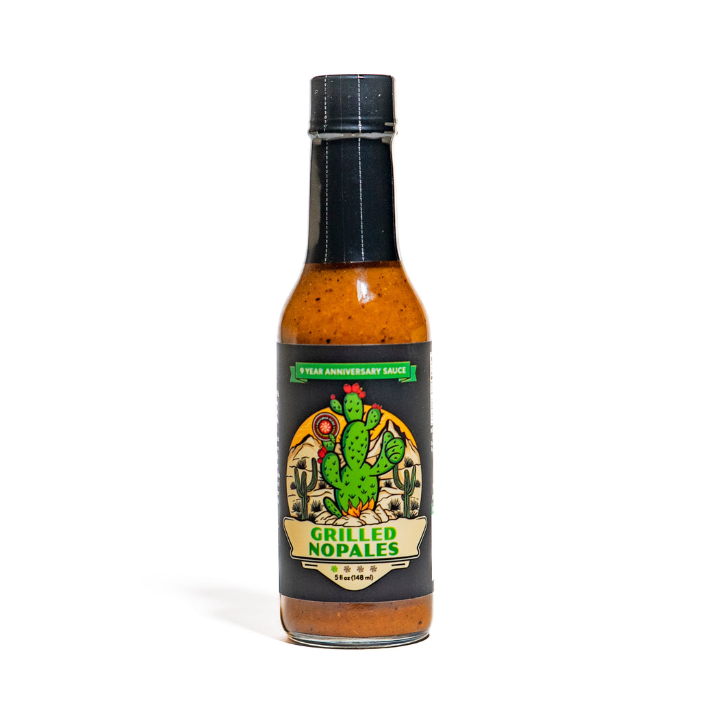 Bottle of Grilled Nopales sauce with a cactus design on the label against a white background