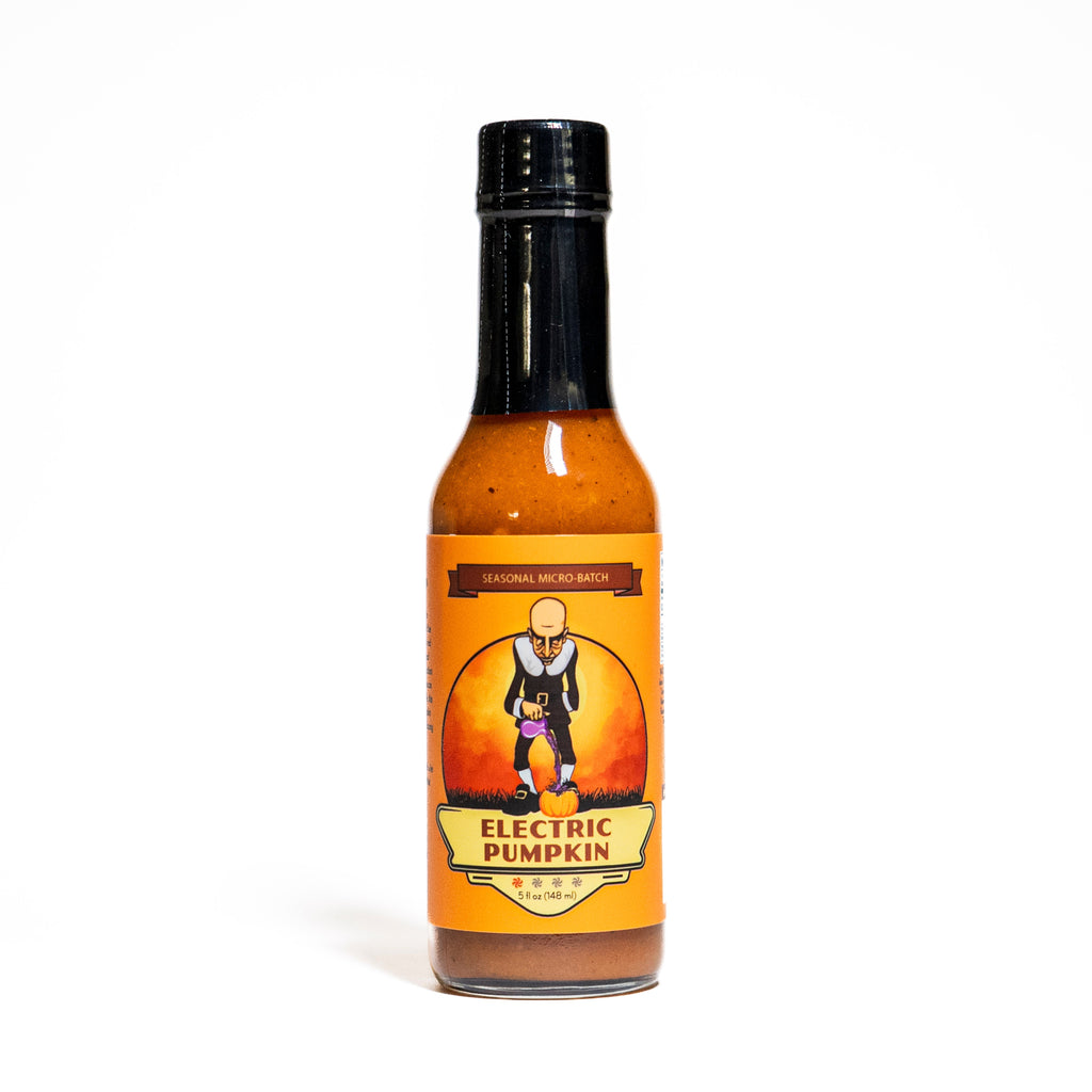Hot sauce bottle labeled Electric Pumpkin on a white background