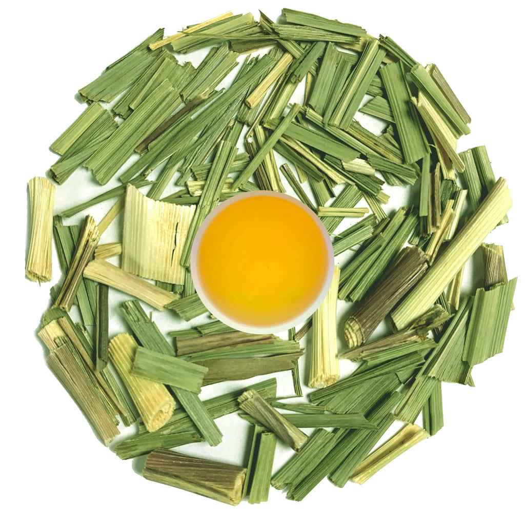 62 lemongrass tea surrounded by loose leaf lemongrass stalks showcasing vibrant colors and freshness.